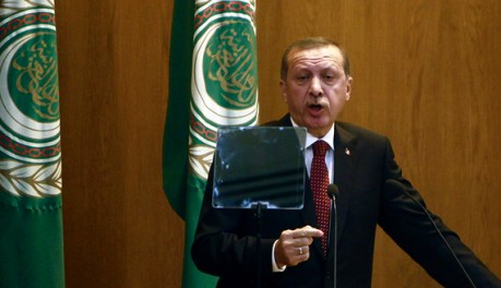 Turkey's PM Erdogan speaks during the opening session of Arab League's foreign ministers meeting at the League headquarters in Cairo