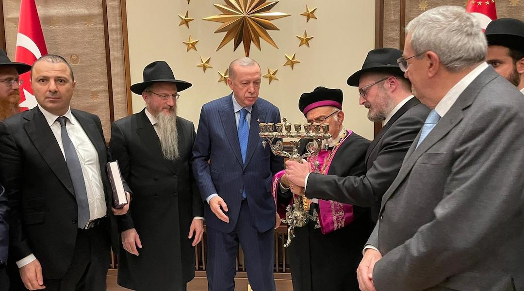 Members of the Alliance of Rabbis in Islamic States gift Turkish President Recep Tayyip Erdogan an ornate menorah